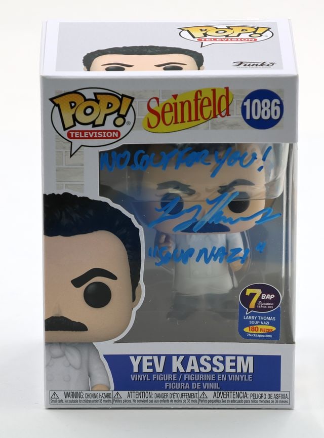 Seinfeld: Larry Thomas Signed "Yev Kassem" Funko Pop #1086 (JSA Authentication): Official Seinfeld "Yev Kassem" Funko Pop #1086 signed on the front plastic window in blue paint pen by actor Larry Thomas, who also inscribed "No Soup For You!" before his signature and "Soup Nazi"