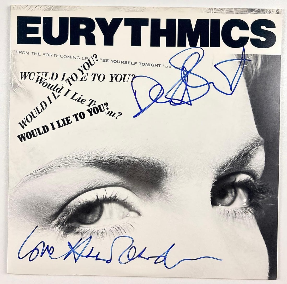 Eurythmics Fully Group Signed "Would I Lie to You?" Album (2 Sigs) (Beckett Authentication): "Would I Lie to You?" album signed on the cover in blue felt tip marker by Eurythmics band members Annie Lennox and Dave Stewart. Measuring approximately 12" x 12" and in fine condition. Record is
