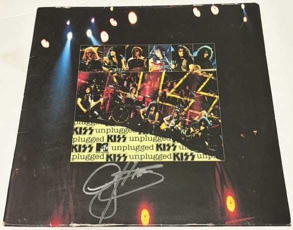 KISS: Gene Simmons Signed "KISS Unplugged" Album (Third Party Guaranteed): "KISS Unplugged" album signed on the cover in silver felt tip marker by KISS band member Gene Simmons. Measuring approximately 12" x 12" and in very good condition, with some signs of scattered wear,