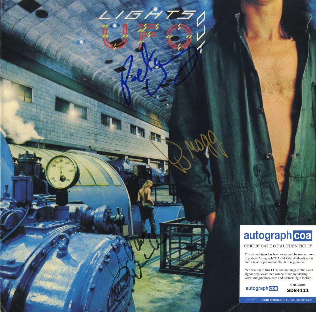 UFO Group Signed "Lights Out" Album (4 Sigs) (ACOA Authentication): "Lights Out" album signed on the cover in blue, black, and gold felt tip markers by UFO band members Phil Mogg, Pete Way, Michael Schenker, and Paul Raymond. Measuring approximately 12" x 12" and in