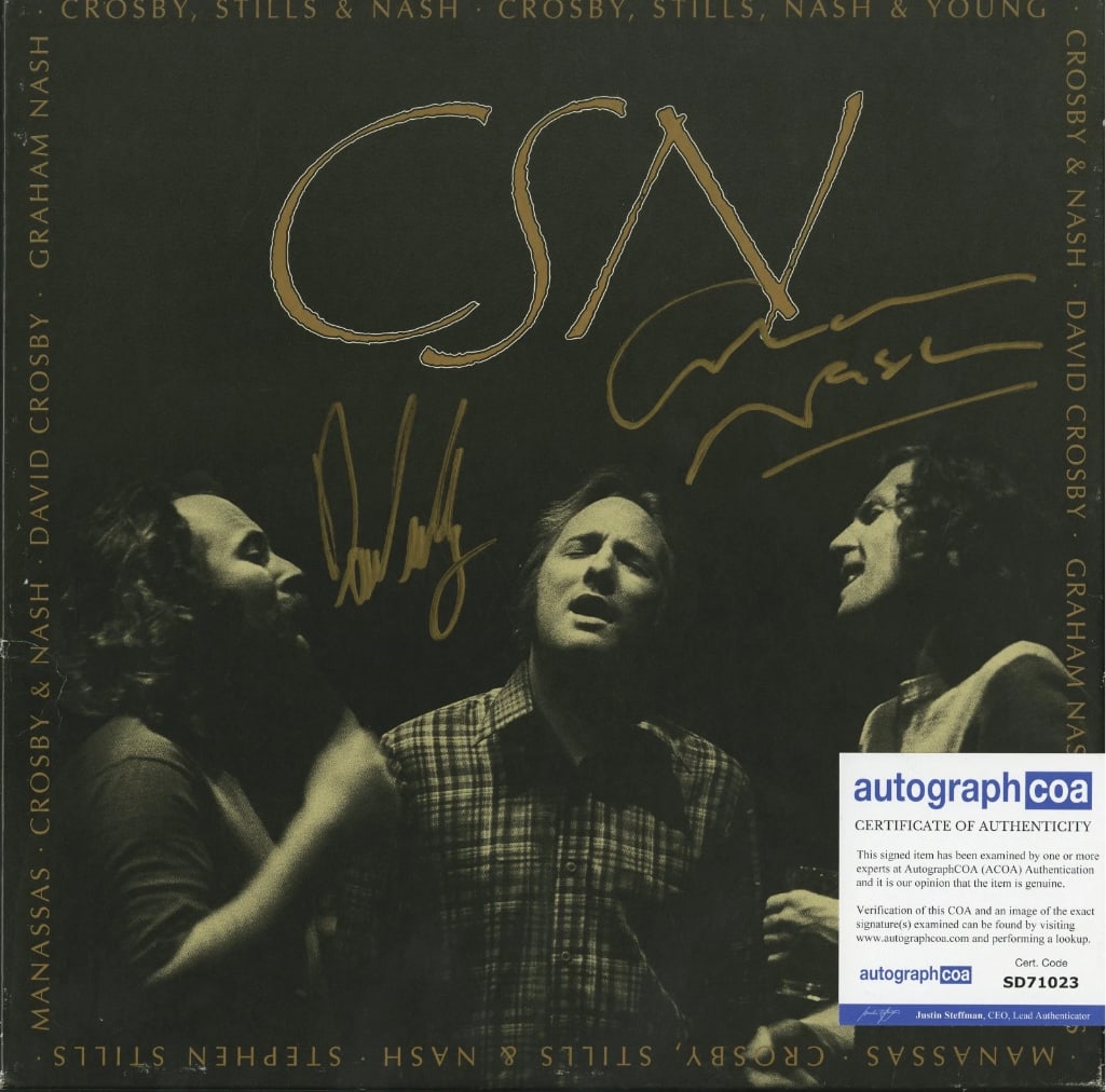 Crosby, Stills, & Nash Fully Group Signed "CSN" CD Box Set (3 Sigs) (ACOA Authentication): "CSN" CD box set signed on the cover in gold felt tip marker by Crosby, Stills, & Nash band members David Crosby, Stephen Stills, and Graham Nash. Measuring approximately 12" x 12" and in fine