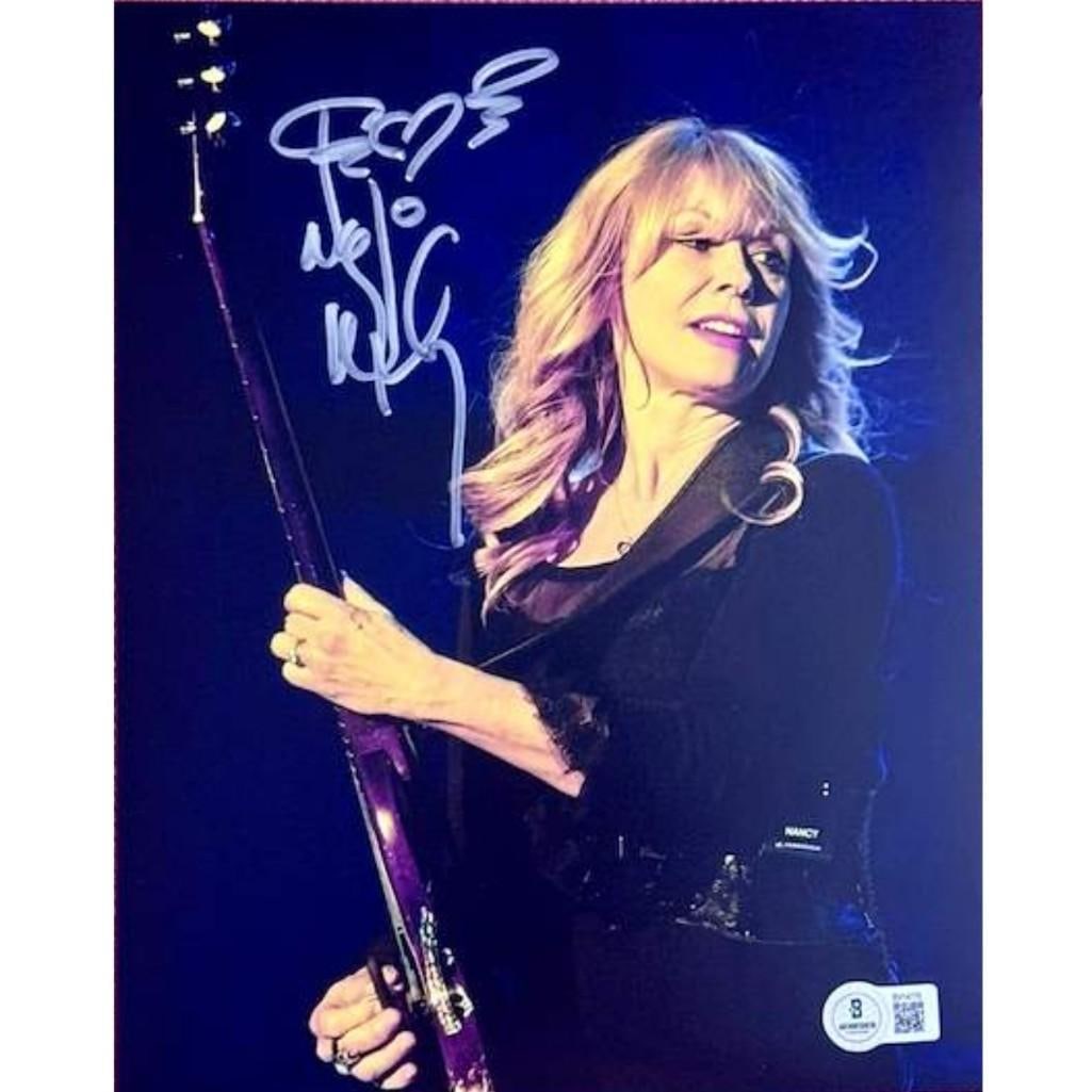Heart: Nancy Wilson Signed 10" x 8" Photo (Beckett Authentication): Color 10" x 8" photo signed in silver paint pen by Heart band member Nancy Wilson. In fine condition. Authenticated by Beckett, with their official hologram affixed to the front bottom right corner
