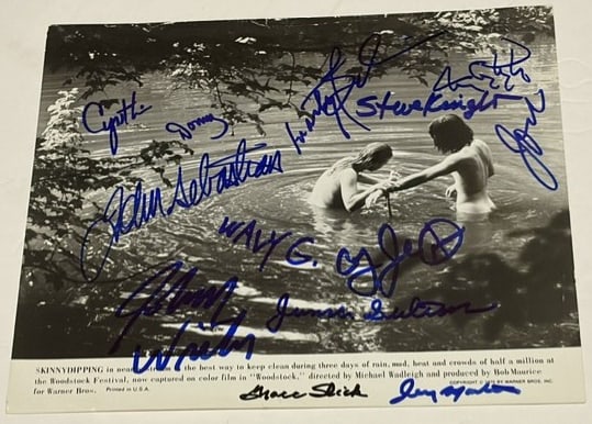 "Woodstock" Film Multi-Signed 7" x 9" Promo Photo (13 Sigs) (Third Party Guaranteed): Black-and-white 7" x 9" promotional photo for the film "Woodstock" signed in black and blue felt tip markers by musicians Grace Slick, Johnny Winter, John Sebastian, Marty Balin, Wavy Gravy, Juma Sult