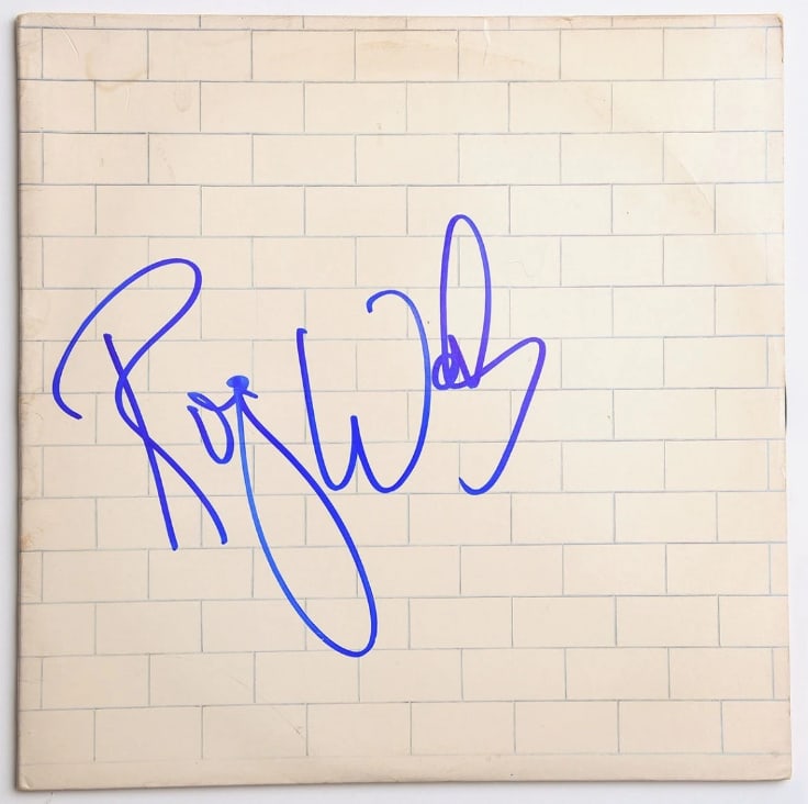 Pink Floyd: Roger Waters Signed "The Wall" Album (Beckett Authentication): "The Wall" album signed on the cover in blue felt tip marker by Pink Floyd band member Roger Waters. Measuring approximately 12" x 12" and in very good condition, with some very slight signs of
