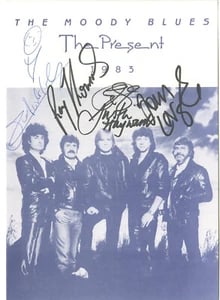 The Moody Blues Group Signed 10" x 8" 1983 Info Booklet (5 Sigs) (ACOA Authentication): Black-and-white 10" x 8" 1983 informational booklet signed on the cover in black felt tip marker and blue ballpoint pen by the Moody Blues band members Graeme Edge, Ray Thomas, Justin Hayword, Patrick