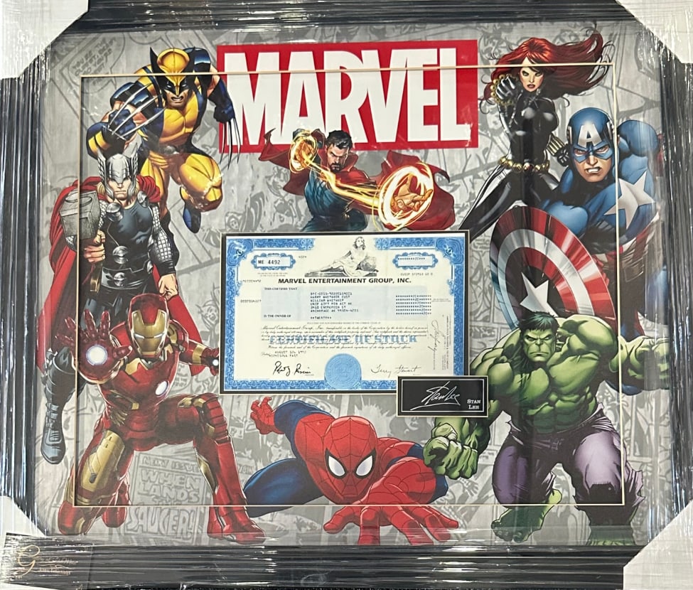 Marvel Entertainment Inc. Stock Certificate & Stan Lee Facsimile Signature 25" x 29" Framed Display: Color 25" x 29" Marvel Entertainment Inc. stock certificate and Stan Lee facsimile signature framed display. Display piece arranges colorful Marvel Avengers characters in backdrop around stock