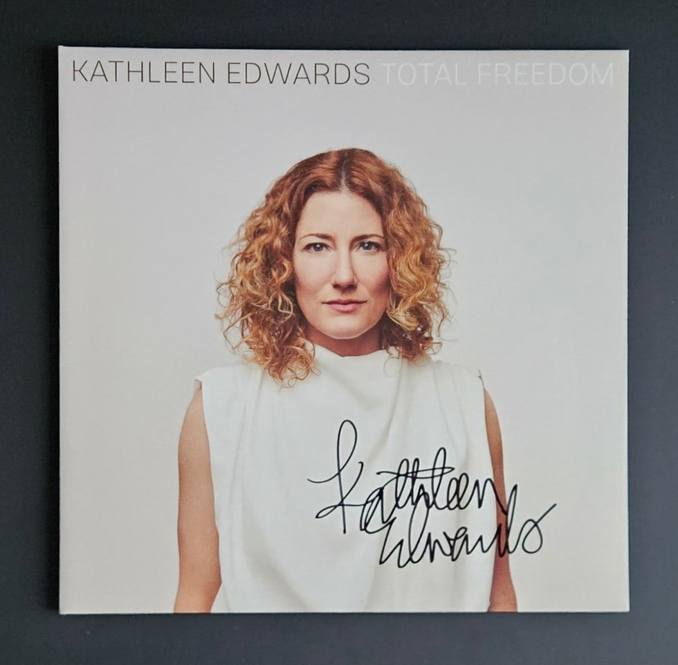 Kathleen Edwards Signed "Total Freedom" Album (Third Party Guaranteed): "Total Freedom" album signed on the cover in black felt tip marker by musician Kathleen Edwards. Measuring approximately 12" x 12" and in fine condition. Record is not included. Provenance Eaton &