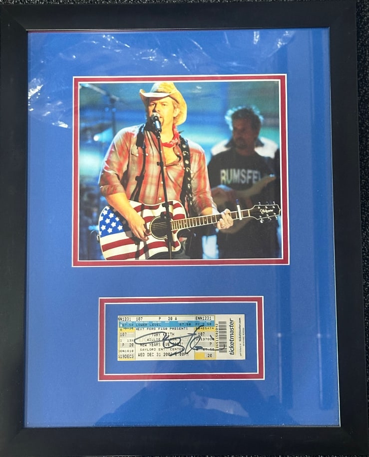 Toby Keith Signed 2003 2.5" x 5" Concert Ticket Framed Display (Third Party Guaranteed): White 2.5" x 5" paper concert ticket framed display signed in black felt tip marker by musician Toby Keith. In fine condition. Ticket is displayed in a frame measuring 20" x 16" overall. Signed
