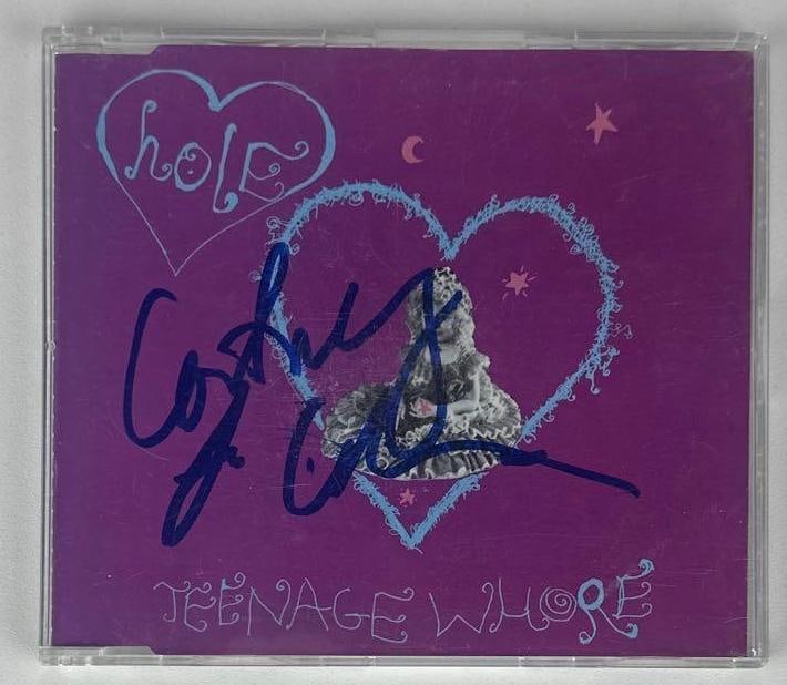 Hole: Courtney Love Signed "Teenage Whore" CD (Beckett Authentication): "Teenage Whore" CD signed on the cover in blue felt tip marker by Hole band member Courtney Love. Measuring approximately 5" x 5" and in fine condition. CD is included. Accompanied by a Beckett COA