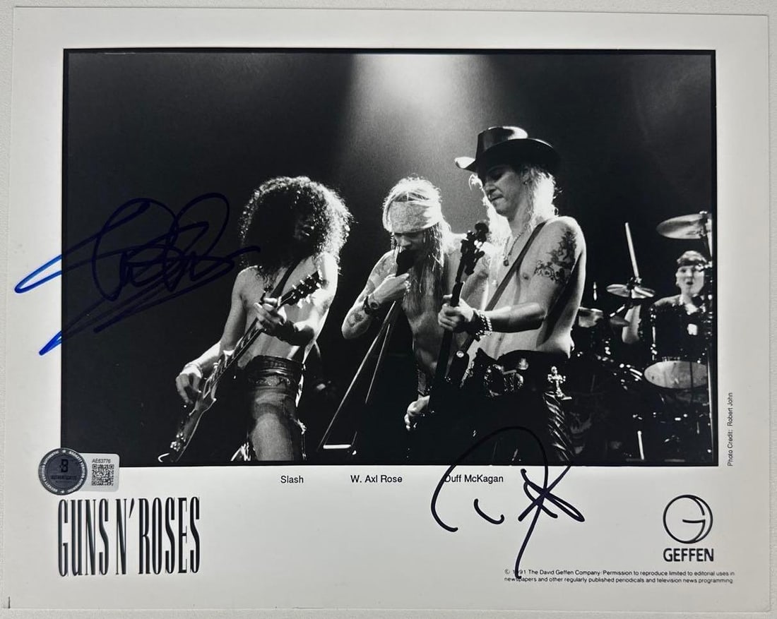 Guns N’ Roses: Slash & Duff McKagan Signed 8" x 10" Promo Photo (2 Sigs) (Beckett Authenticati: Black-and-white 8" x 10" promotional photo signed in blue and black felt tip markers by Guns N' Roses band members Slash and Duff McKagan. In fine condition. Accompanied by a full Letter of