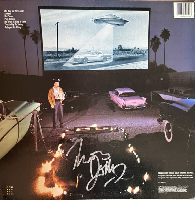 Thomas Dolby Signed "Aliens Ate My Buick" LP Album (Third Party Guaranteed): "Aliens Ate My Buick" LP album signed on the back cover in silver felt tip marker by musician Thomas Dolby. Measuring approximately 12" x 12" and in very good condition, with some signs of scattered