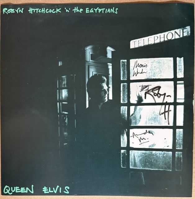 Robyn & the Egyptians Group Signed "Queen Elvis" LP Poster Flat (3 Sigs) (Third Party Guaranteed): Color 12" x 12" "Queen Elvis" LP poster flat signed on the cover in black felt tip marker by Robyn Hitchcock and the rest of the Egyptians Morris Windsor and Andy Metcalfe. In fine condition.