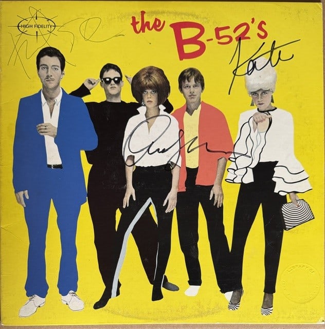 The B-52's Group Signed "S/T" LP Album (3 Sigs) (Third Party Guaranteed): "The B-52's" LP album signed on the cover in black felt tip marker and black ballpoint pen by the B-52's band members Fred Scheider, Cindy Wilson, and Kate Pierson. Measuring approximately 12" x 12"