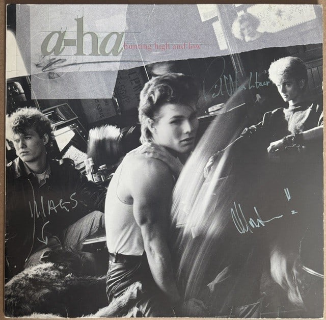 A-ha Fully Group Signed "Hunting High & Low" LP Album (3 Sigs) (Third Party Guaranteed): "Hunting High & Low" LP album signed on the cover in black and silver felt tip markers by A-ha band members Morten Harket, who additionally signed on the back, Magne Furuholmen, and Paul