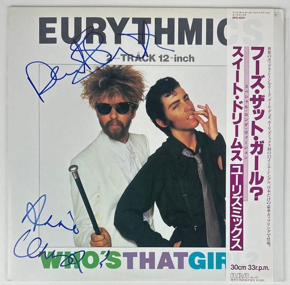 Eurythmics Fully Group Signed "Who's That Girl" Japanese Album (2 Sigs) (Beckett Authentication): "Who's That Girl" Japanese album signed on the cover in blue felt tip marker by Eurythmics band members Annie Lennox and Dave Stewart. Measuring approximately 12" x 12" and in fine condition. Record