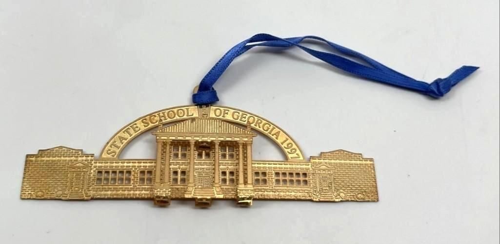 President Jimmy Carter Personally-Owned 1997 Georgia State School Ornament (Ex. Carter Estate): Gold 3.5" x 1.5" "State School of Georgia 1997" Christmas ornament owned by 39th President of the United States Jimmy Carter. In fine condition. Accompanied by a Certificate of Authenticity