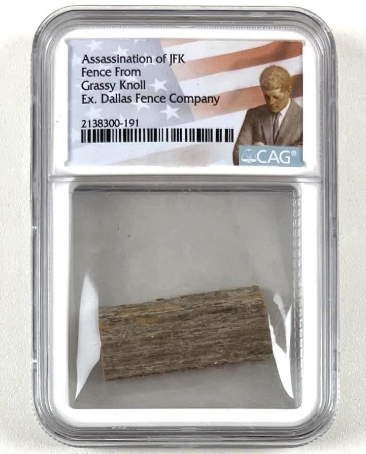 President JFK Assassination Grassy Knoll Fence Sample (CAG Encapsulated): Brown 1" x 1" wooden fence sample of the Grassy Knoll from the Dallas Fence Company, the sight of 35th President John F. Kennedy's assassination. In fine condition. Encapsulated and authenticated by