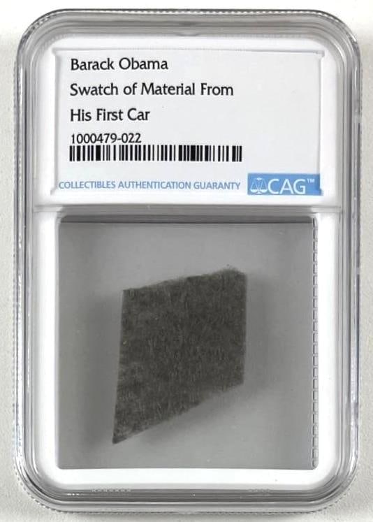 President Barack Obama First Car Jeep Grand Cherokee Black Fabric Swatch (CAG Encapsulated): Black fabric ~0.5" x 0.5" swatch from President Barack Obama's first car, a Jeep Grand Cherokee. In fine condition. Encapsulated and authenticated by CAG (#1000479-022). This sample was obtained