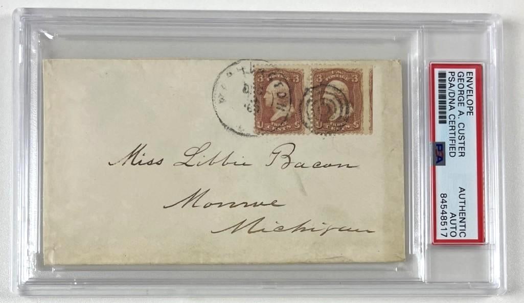 George Armstrong Custer Handwritten 3.25" x 3" Envelope (PSA/DNA Encapsulated): White paper 3.25" x 3" envelope filled out by hand in black ink by Union Army officer George Armstrong Custer. Envelope is addressed to his future wife "Miss Libbie Bacon" in Michigan and has two 3 ce