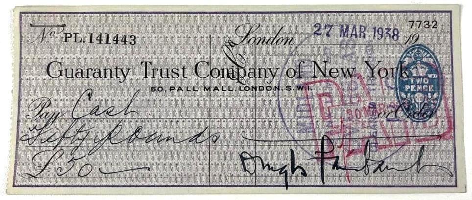 Douglas Fairbanks Signed "Guaranty Trust Company of New York" 1938 Check: Paper 2.75" x 6.5" check signed in black ink by silent-film actor Douglas Fairbanks to the "Guaranty Trust Company of New York." Check is dated March 27th, 1938, for the price of £50. Back side