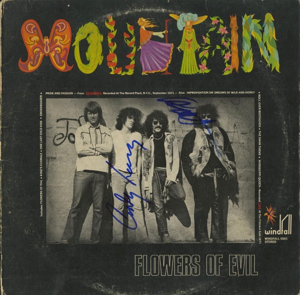 Mountain: Corky Laing & Leslie West Signed "Flowers of Evil" Album (2 Sigs) (ACOA Authentication): "Flowers of Evil" album signed on the cover in blue felt tip marker by Mountain band members Corky Laing and Leslie West. Measuring approximately 12" x 12" and in very good condition, with some signs