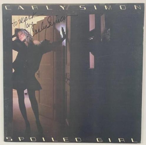 Carly Simon Signed "Spoiled Girl" Album (Third Party Guaranteed): "Spoiled Girl" album signed on the cover in black felt tip marker by musician Carly Simon, who inscribed the message "To Mark love" before her signature. Measuring approximately 12" x 12" and in fine