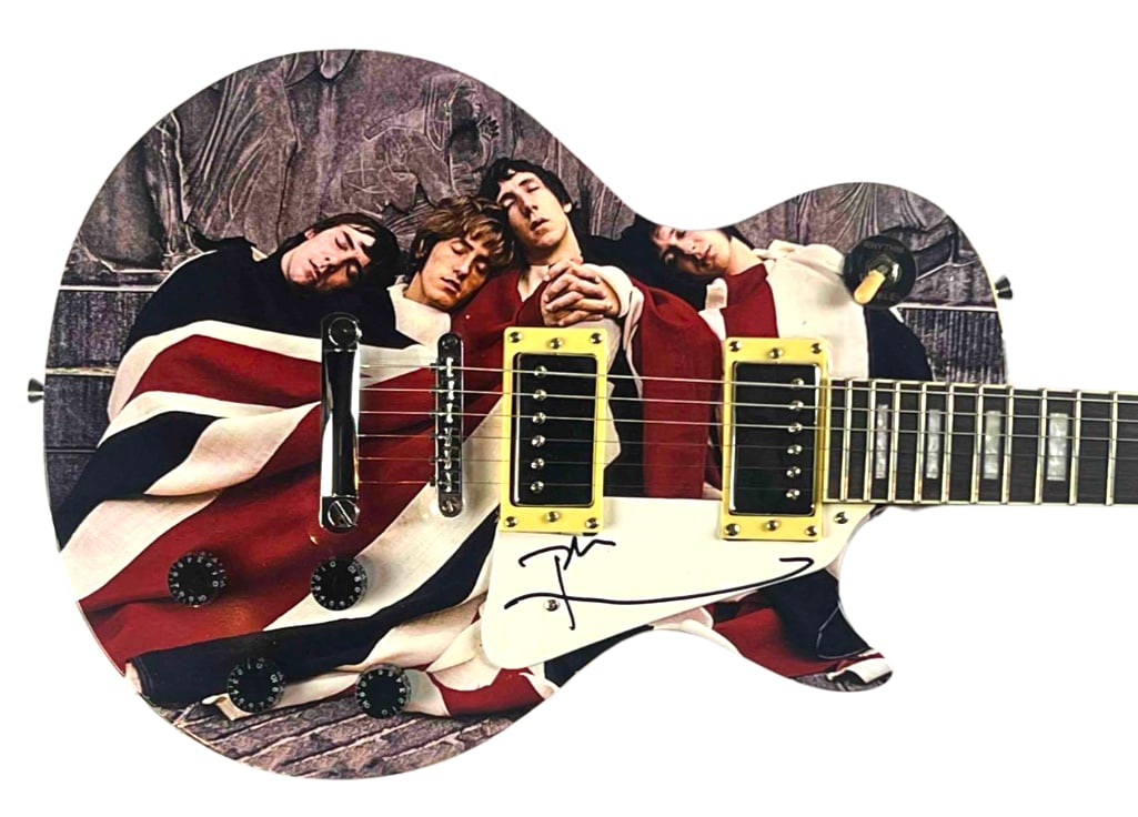 The Who: Pete Townshend Signed Custom "The Kids Are Alright" Graphics Les Paul-Style Guitar (JSA): "The Kids are Alright" custom graphics Les Paul-style guitar signed on the pickguard in black felt tip marker by the Who band member Pete Townshend. Measuring approximately 39" x 13" and in fine