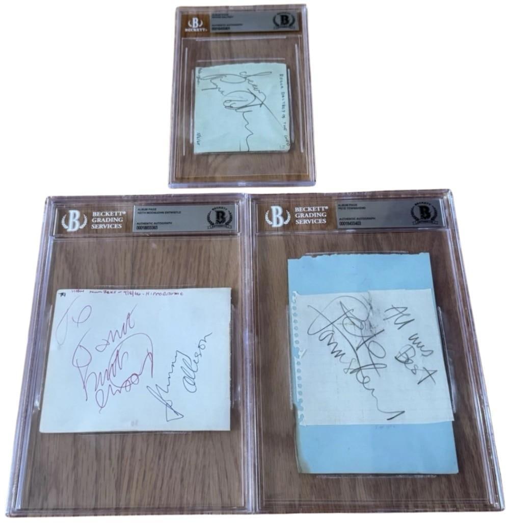 The Who Fully Group Signed Set of (3) Signed Cuts (Beckett Encapsulated): Set of (3) cuts cumulatively signed by The Who. White 4" x 5" cut signed in red and black ballpoint pens by the Who band members John Entwistle, who signed “Johnny Allison,” a name he