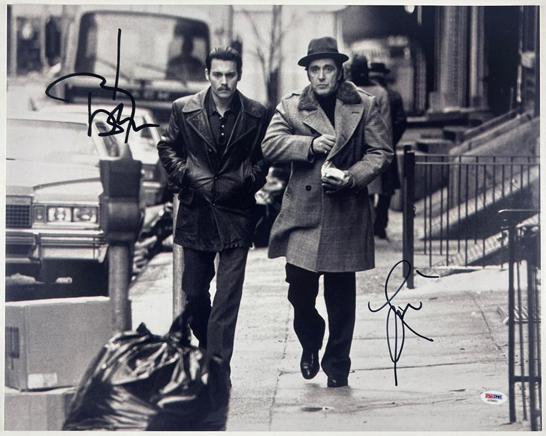 Donnie Brasco: Johnny Depp & Al Pacino Signed 16" x 20" Photo (2 Sigs) (PSA/DNA): Black-and-white 16" x 20" photo of the characters Donnie Brasco and Benjamin 'Lefty' Ruggiero from the film "Donnie Brasco" signed in black felt tip marker actors Johnny Depp and Al Pacino. In fine co