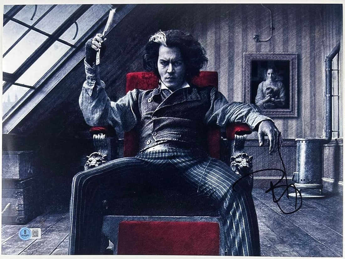 Sweeney Todd: Johnny Depp Signed 11.75" x 16" Photo (Beckett Authentication): Color 11.75" x 16" photo of the character Sweeney Todd from the film "Sweeney Todd" signed in black felt tip marker by actor Johnny Depp. In fine condition. Authenticated by Beckett, with their