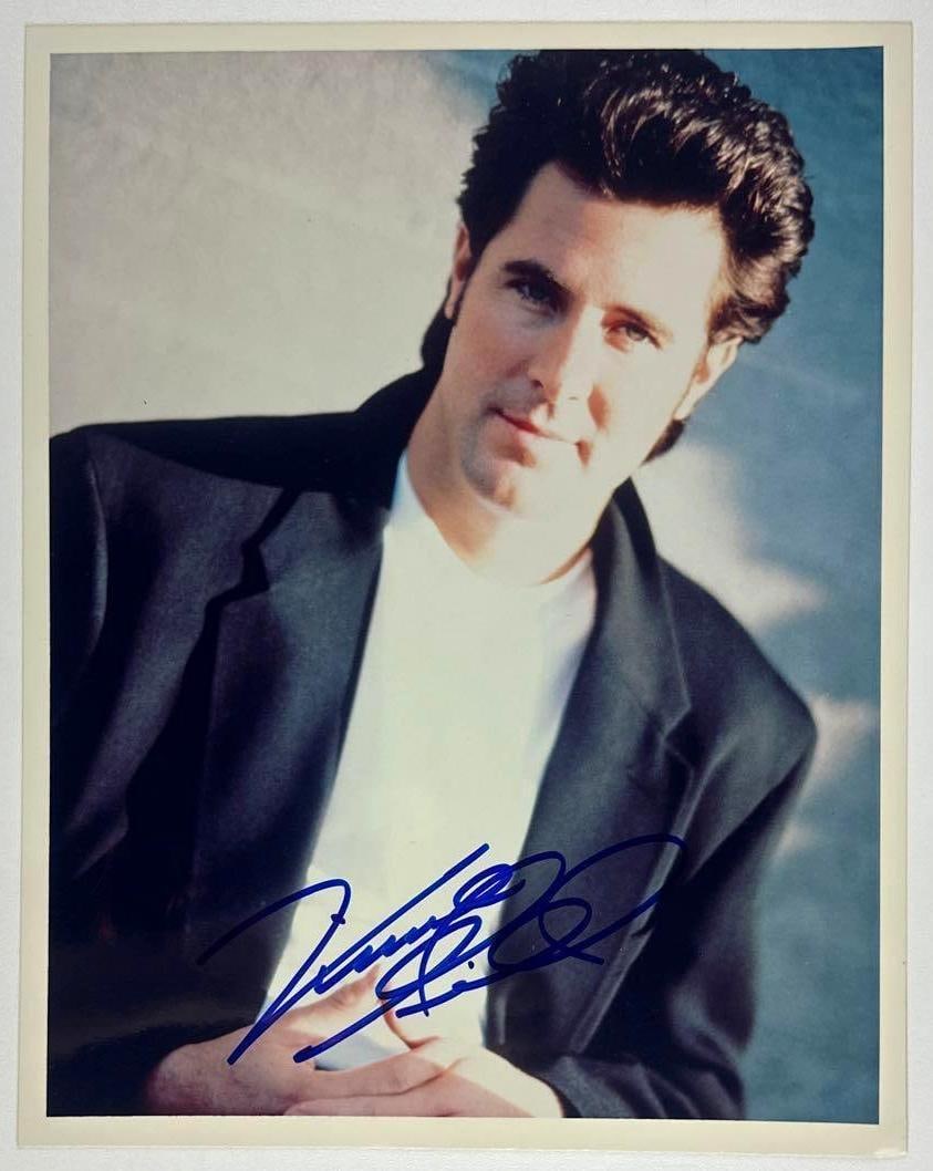 Vincent Gill Signed 8" x 10" Photo (Third Party Guaranteed): Color 8" x 10" photo signed in blue felt tip marker by Eagles band member Vincent Gill. In fine condition. Provenance Eaton & Brennan Auctions guarantees this lot to pass Third-Party Authentication.