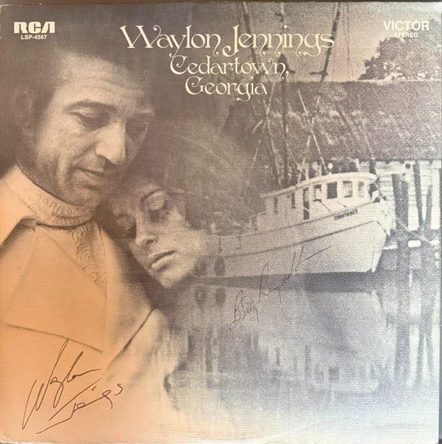 Waylon Jennings & Billy Ray Reynolds Signed "Cedartown, Georgia" Album (2 Sigs) (Third Party): "Cedartown, Georgia" album signed on the cover in black felt tip marker by Waylon Jennings and Billy Ray Reynolds. Measuring approximately 12" x 12", the jacket shows light handling wear with soft