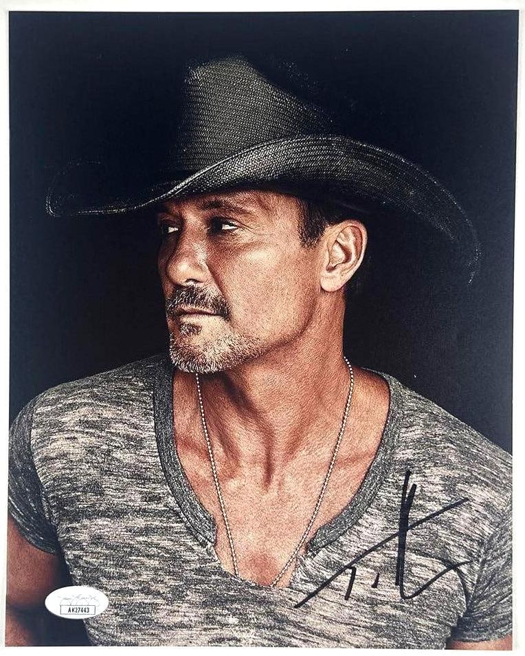 Tim McGraw Signed 10" x 8" Photo (JSA Authentication): Color 10" x 8" photo signed in black felt tip marker by musician Tim McGraw. In fine condition. Accompanied by a JSA COA (#AK27443).