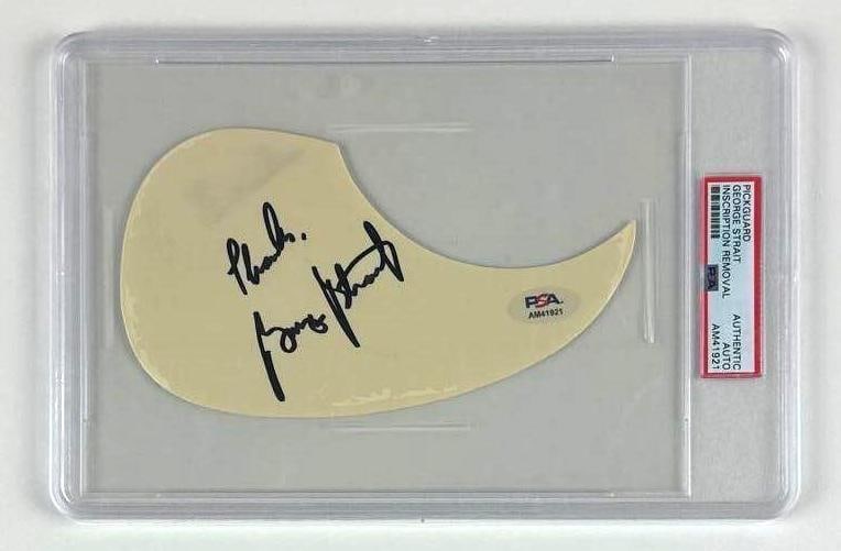 George Strait Signed Acoustic Guitar Pickguard (PSA/DNA Encapsulated): White 4" x 7" acoustic guitar pickguard signed on the front in black felt tip marker by musician George Strait. In fine condition. Authenticated and encapsulated by PSA/DNA (#AM41921).