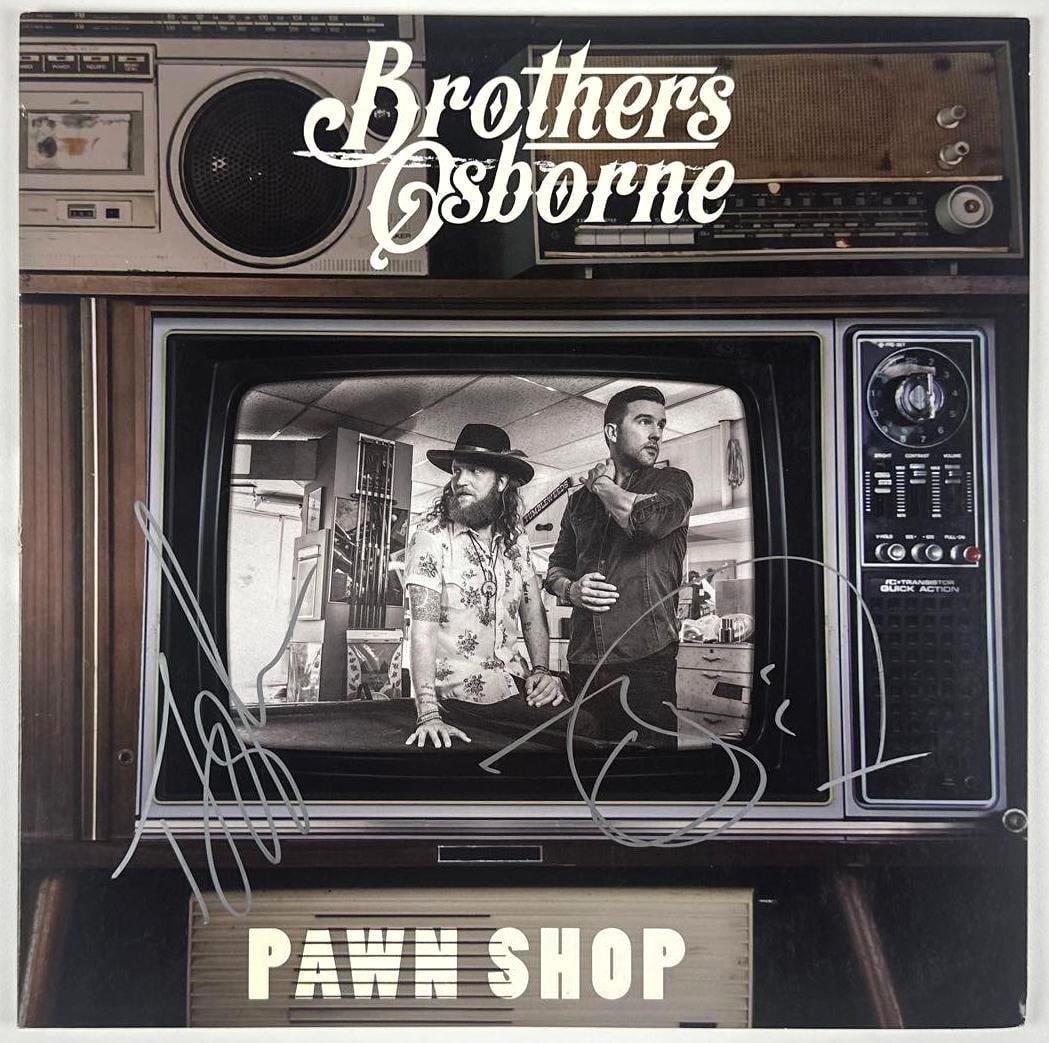 Brothers Osborne Signed "Pawn Shop" Album (Beckett Authentication): "Pawn Shop" album signed on the front cover in silver metallic paint pen by Brothers Osborne duo members T.J. Osborne and John Osborne. Measuring approximately 12" x 12" and in very good condition