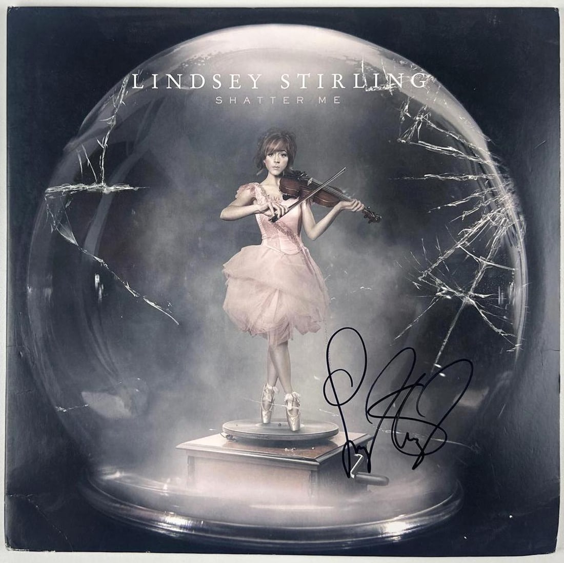 Lindsey Sterling Signed "Shatter Me" Album (Beckett Authentication): "Shatter Me" album signed on the cover in black felt tip marker by musician Lindsey Sterling. Measuring approximately 12" x 12" and in fine condition. Record is included. Authenticated by Beckett,