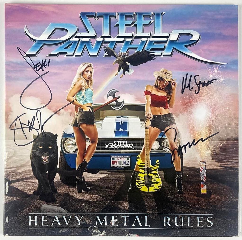 Steel Panther Signed "Heavy Metal Rules" Album (JSA Authentication): "Heavy Metal Rules" album signed on the cover in black felt tip marker by Steel Panther band members Michael Starr, Satchel, Lexxi Foxx, and Stix Zadinia. Measuring approximately 12" x 12" and in