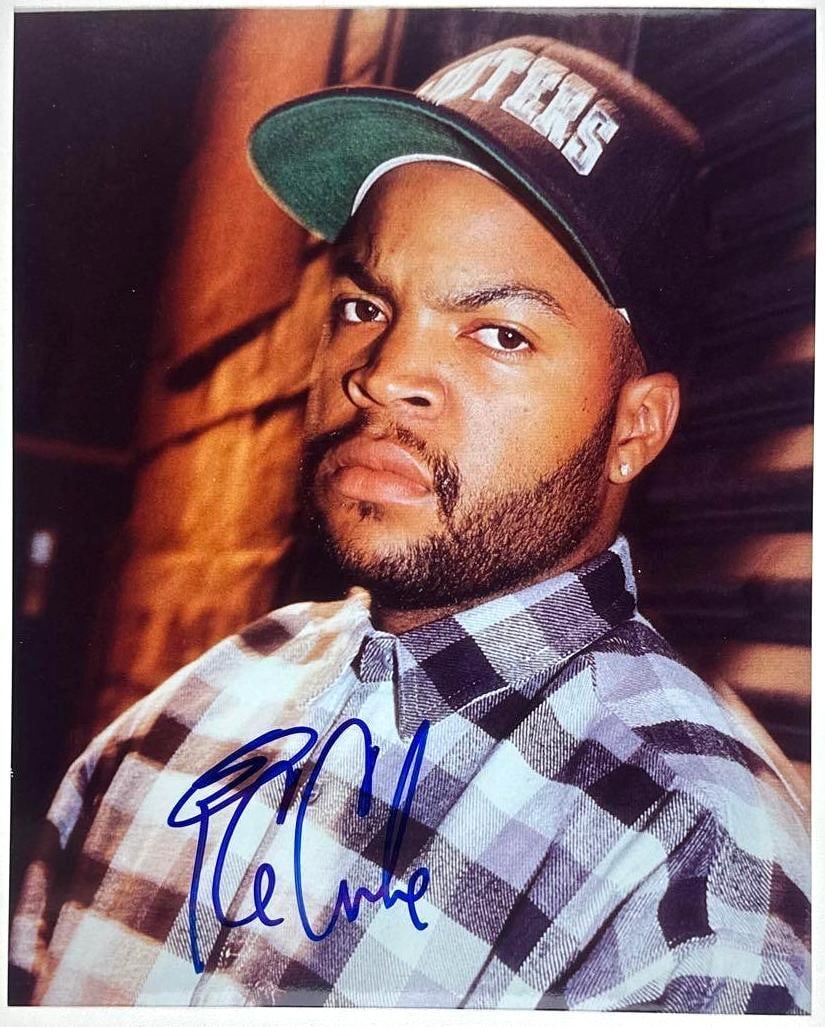 Ice Cube Signed 8" x 10" Photo (Third Party Guaranteed): Color 8" x 10" photo signed in blue felt tip marker by musician Ice Cube. In fine condition. Provenance Eaton & Brennan Auctions guarantees this lot to pass Third-Party Authentication. Please review