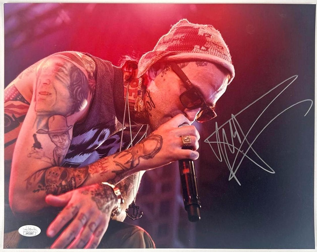 Yelawolf Signed 11" x 14" Photo (JSA Authentication): Color 11" x 14" signed in silver felt tip marker by musician Yelawolf. In fine condition. Accompanied by a JSA COA (#AM32087).