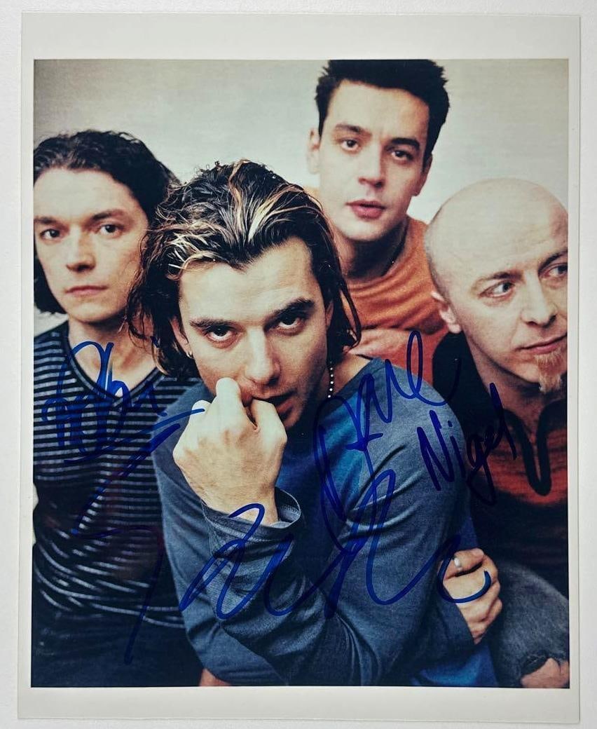 Bush Group Signed 10" x 8" Photo (4 Sigs) (JSA Authentication): Color 10" x 8" photo signed in blue felt tip marker by Bush band members Nigel Pulsford, Dave Parsons, Robin Goodridge, and Gavin Rossdale. In fine condition. Authenticated by JSA. Provenance This
