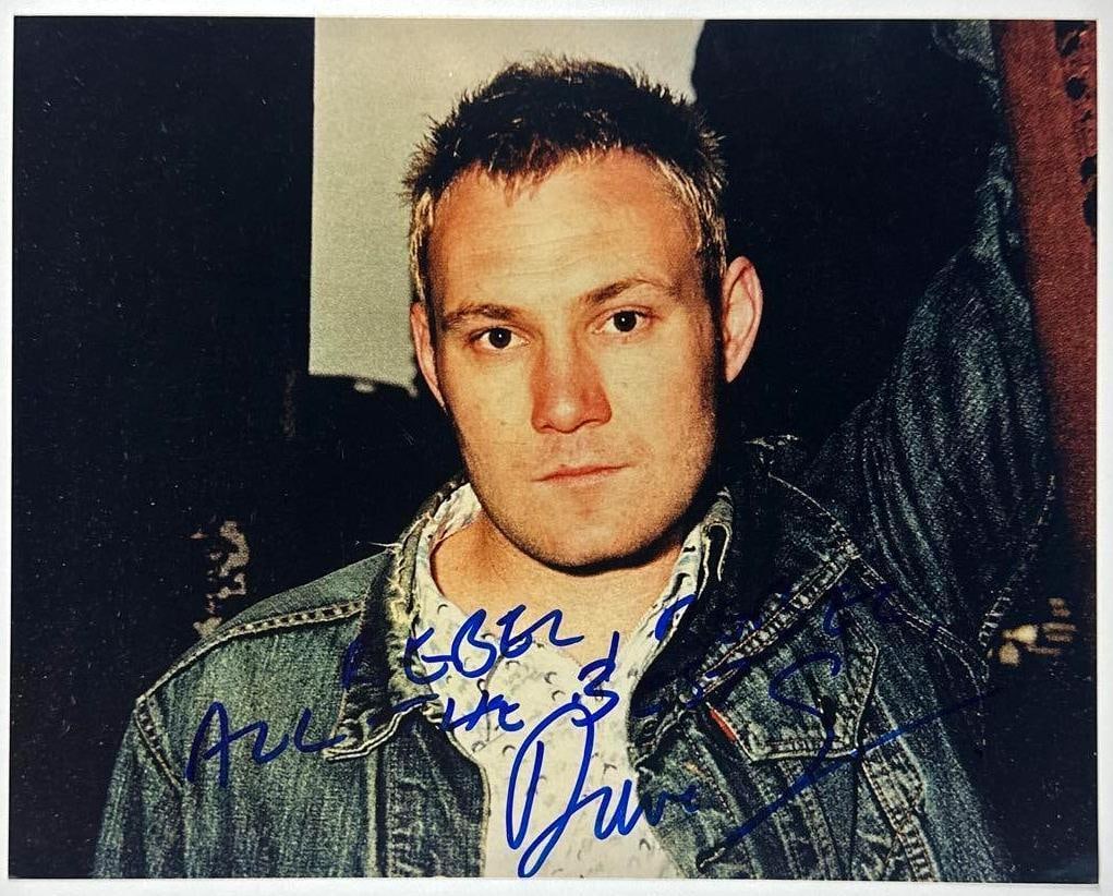 David Gray Signed 10" x 8" Photo (Third Party Guaranteed): Color 10" x 8" photo signed in blue felt tip marker by musician David Gray. In fine condition. Provenance Eaton & Brennan Auctions guarantees this lot to pass Third-Party Authentication. Please