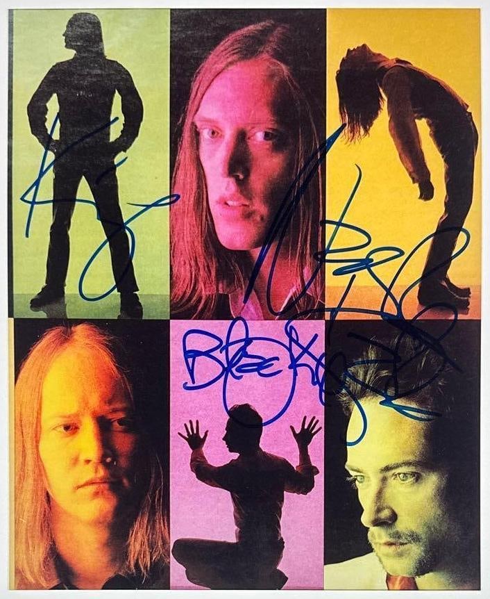 Urge Overkill Group Signed 10" x 8" Photo (3 Sigs) (Third Party Guaranteed): Color 10" x 8" six-panel color-tinted collage photo signed in blue felt tip marker by Johnny 'Blackie Onassis,' Nash Kato, and Eddie 'King' Roeser. In fine condition. Provenance Eaton & Brennan