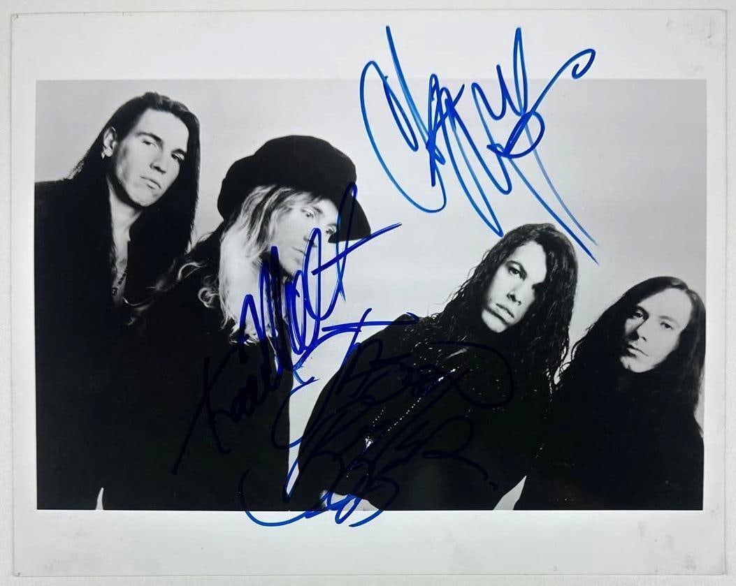 Saigon Kick Fully Group Signed 8" x 10" Photo (4 Sigs) Third Party Guaranteed): Black-and-white 8" x 10" photo signed in blue felt tip marker by Saigon Kick band members Matt Kramer, Jason Bieler, Tom DeFile, and Phil Varone. In fine condition. Provenance Eaton & Brennan Auctions