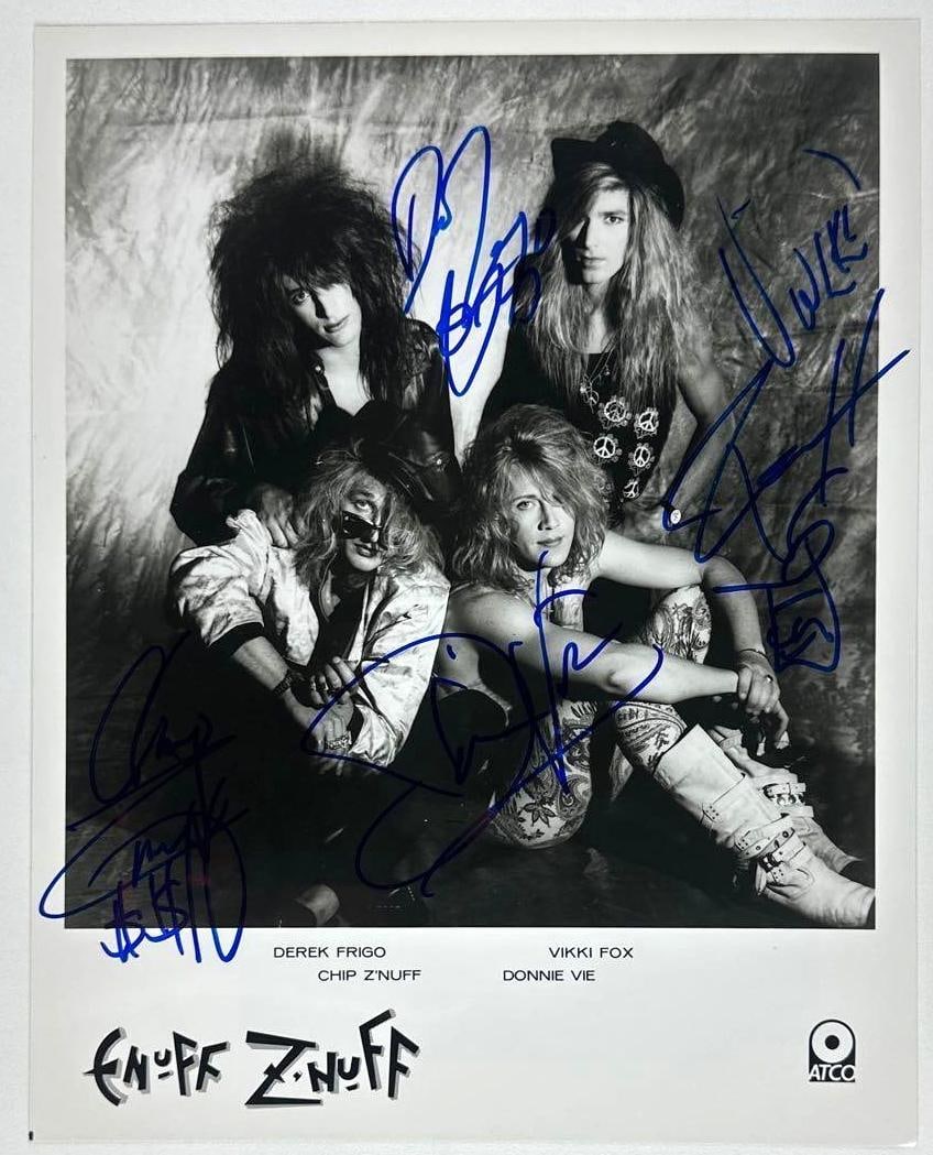 Enuff Znuff Group Signed 8" x 10" Promo Photo (4 Sigs) (Third Party Guaranteed): Black-and-white 8" x 10" promotional photo signed in blue felt tip marker by Enuff Znuff band members Chip Znuff, Vikki Fox, Derek Frigo, and Donnie Vee, all of whom inscribed doodles by their respect