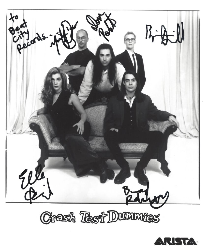 Crash Test Dummies Signed 10" x 8" Promo Photo (5 Sigs) (ACOA Authentication): Black-and-white 10" x 8" promo photo signed in black felt tip marker by Crash Test Dummies band members Brad Roberts, Dan Roberts, Ellen Reid, Mitch Dorge, who inscribed "to Beat City Records" before