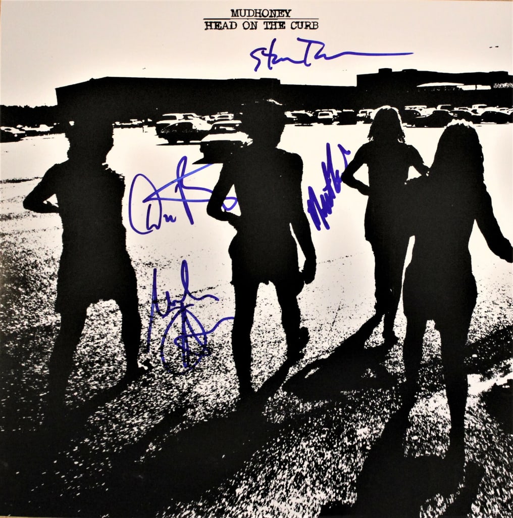 Mudhoney Fully Group Signed "Head On The Curb" Album (4 Sigs) ACOA Authentication): "Head On The Curb" album signed on the front cover in blue felt tip marker by Mudhoney band members Mark Arm, Steve Turner, Dan Peters, and Matt Lukin. Measuring approximately 12" x 12" and in good