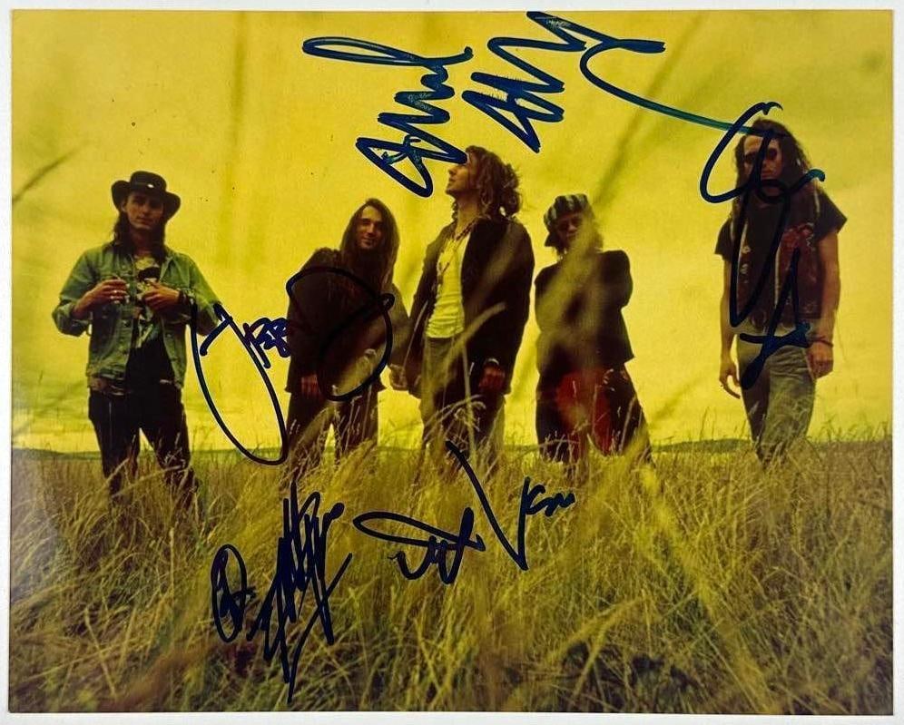 Pearl Jam Fully Group Signed 8" x 10" Photo (5 Sigs) (Beckett Authentication): Awesome color 8" x 10" photo signed in blue felt tip marker by Pearl Jam band members Eddie Vedder, Jeff Ament, Stone Gossard, Mike McCready, and Dave Abbruzzese. In fine condition. Accompanied by a