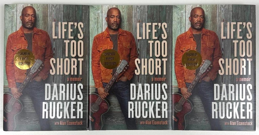 Hootie & the Blowfish: Darius Rucker Signed Group Lot of (3) "Life's Too Short" Books (Beckett): Group lot of (3) color hardcover 9.5" x 6.25" "Life's Too Short" books signed on the inside front page in black ballpoint pen by Hootie & the Blowfish band member Dairus Rucker. All in fine