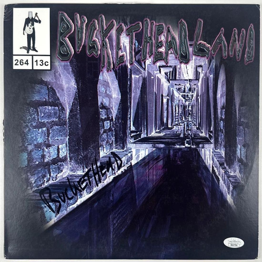 Buckethead Signed "Bucketheadland" Album (JSA Authentication): "Bucketheadland" album signed on the cover in black felt tip marker by musician Buckethead. Measuring approximately 12" x 12" and in very good condition, with some signs of scattered wear. Record is