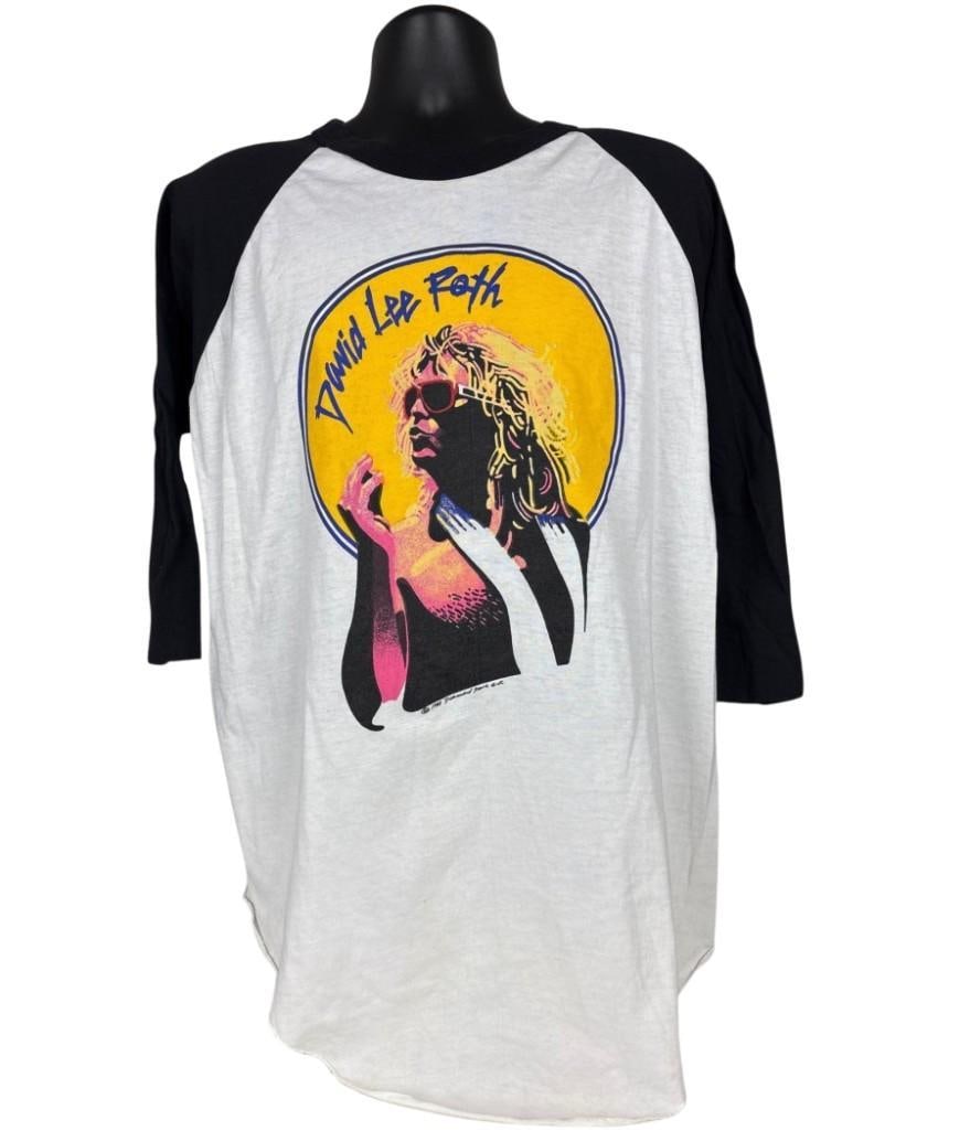 Van Halen: David Lee Roth 1981 "Crazy From the Heat" Tour T-Shirt (Chip Rachlin Collection): Vintage original white, black, and yellow large-sized 28" x 22" David Lee Roth "Crazy From the Heat" t-shirt. The front features a silhouette of Roth with a yellow background and blue text of his